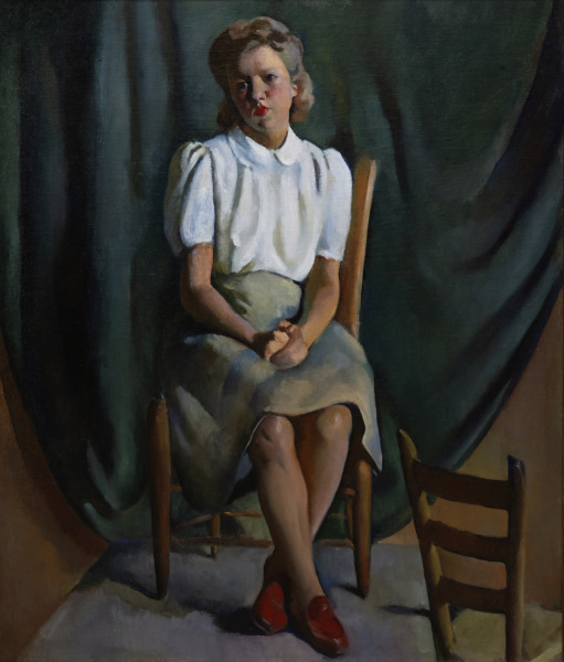 Young Woman Seated in a Chair with a Green Backdrop